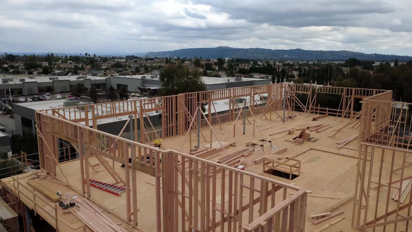 Top-floor wall lines against the San Gabriel horizon
