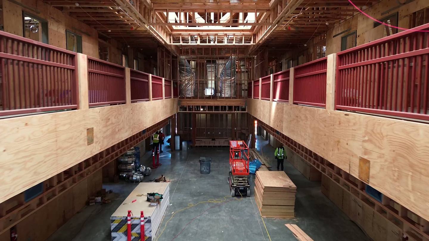 Inside the two-story atrium, framing and guardrails in place