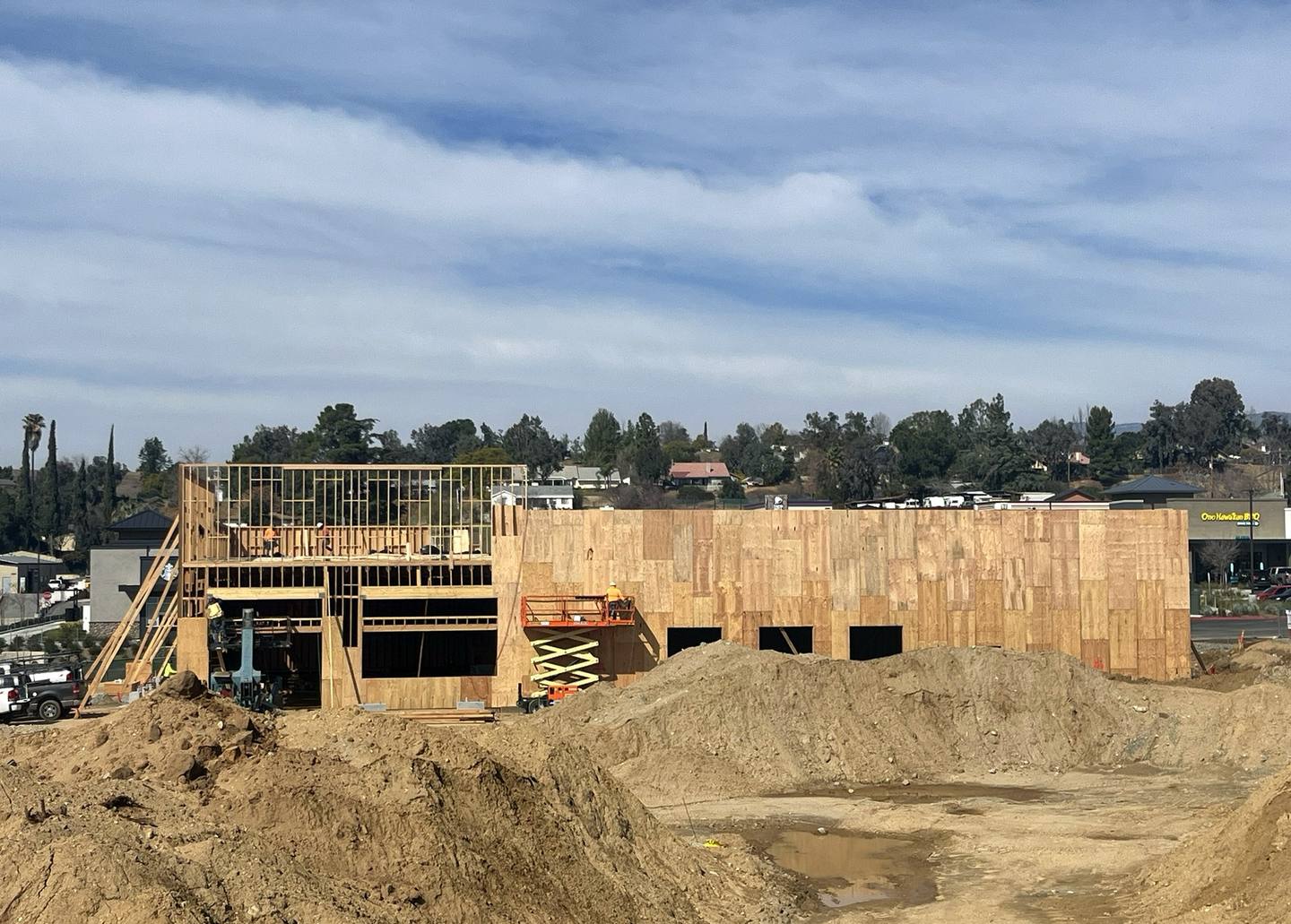 Sheathed elevation with lifts working