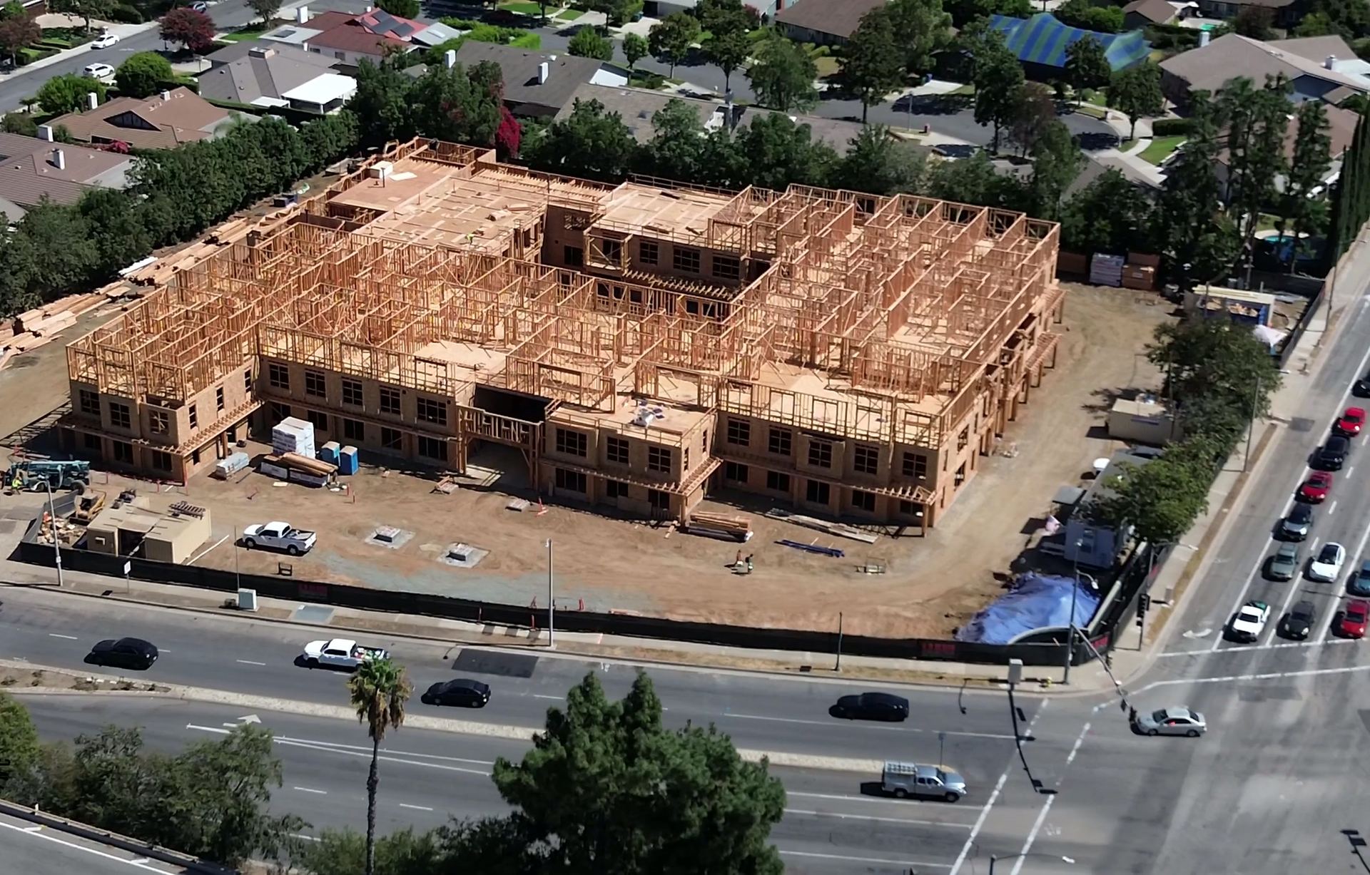 The Ivy, Arcadia — three-story wood-framed block by PJ Empire, from the air